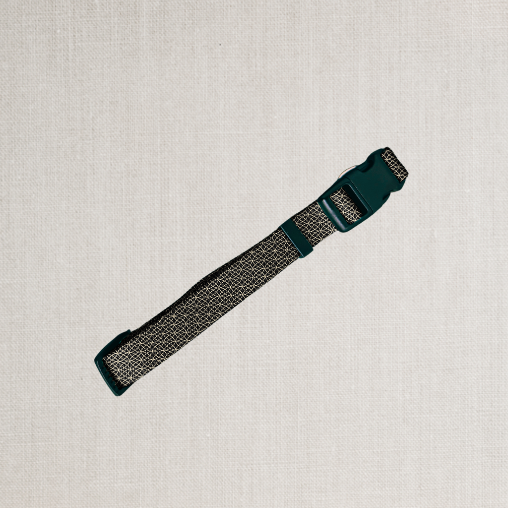A black and gold design on dog collar
