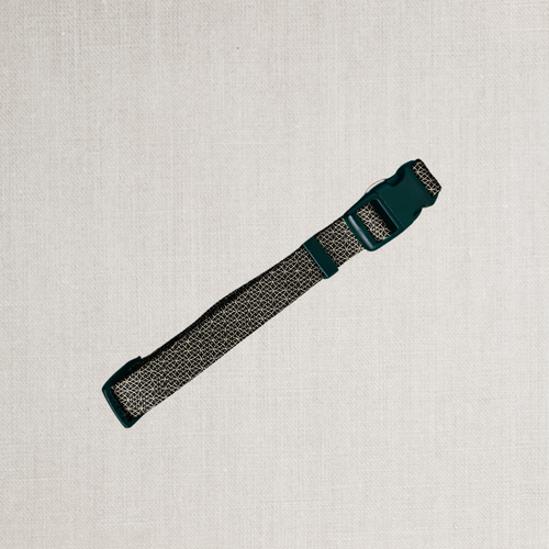 A black and gold design on dog collar
